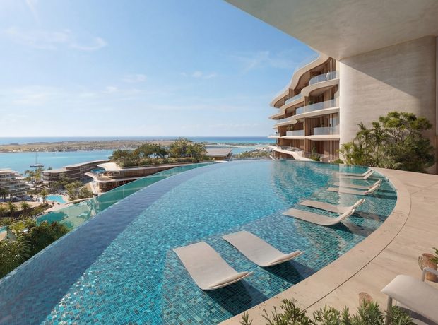 An adults’ infinity pool over the shore